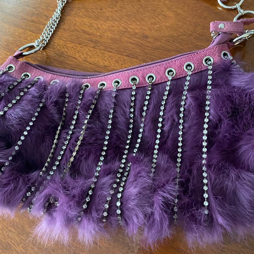 Stunning purple fur bag with rhinestone detailing.